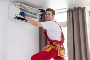 HVAC technician performing air conditioner repair and maintenance